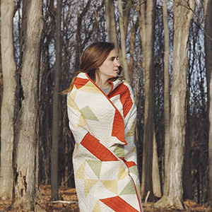 Person wrapped in quilt